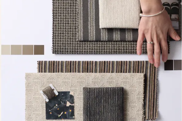 Selection of Revolution Fabrics premium fabric choices and design styling elements on an in-home workspace.
