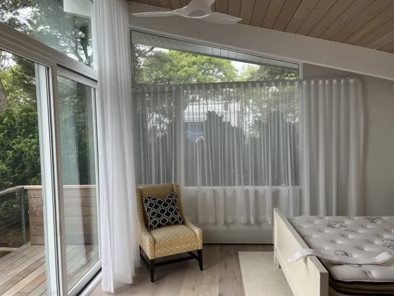 Premium draperies custom-installed in a coastal home setup in Wellfleet, Massachusetts.